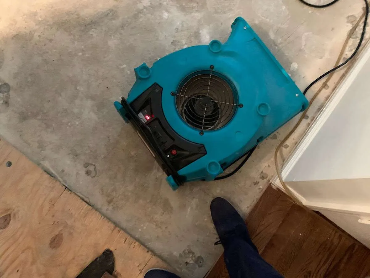 Air mover drying subfloor during Leak Detection & Repair in Hoosick